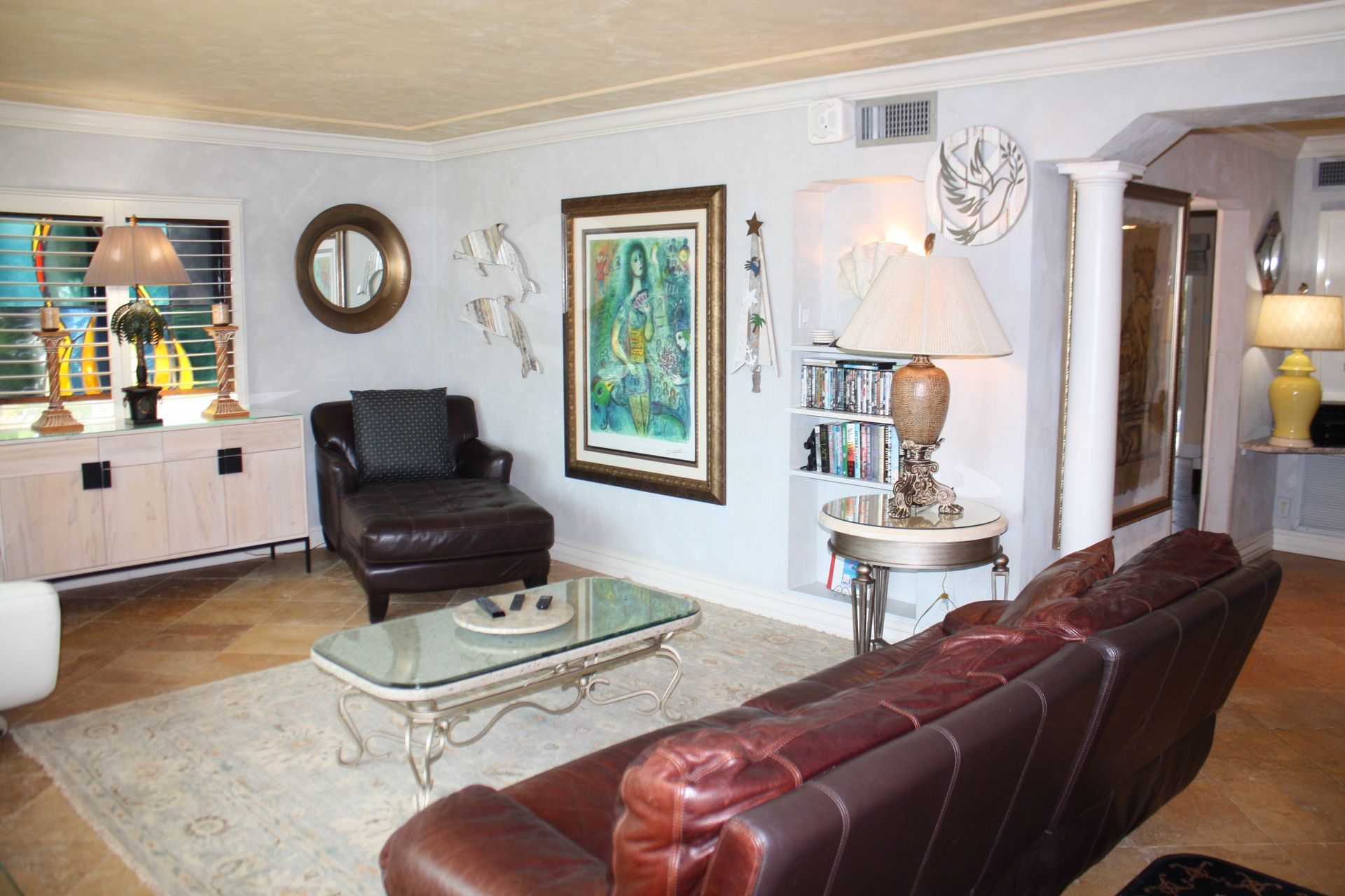 A living room with a couch a chair and a coffee table