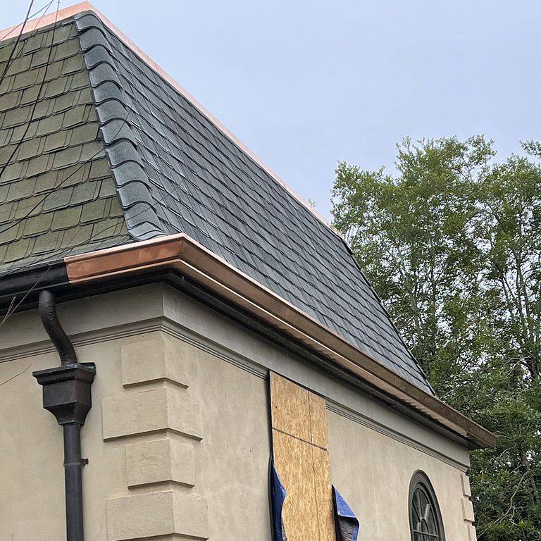 siding and grey tile roof repairs McDonough, GA Total Roof Solutions