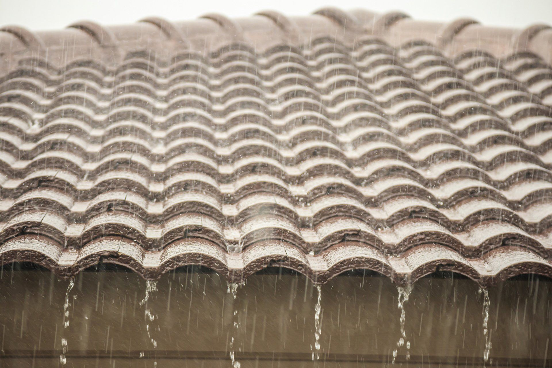 rain falling off a rooftop