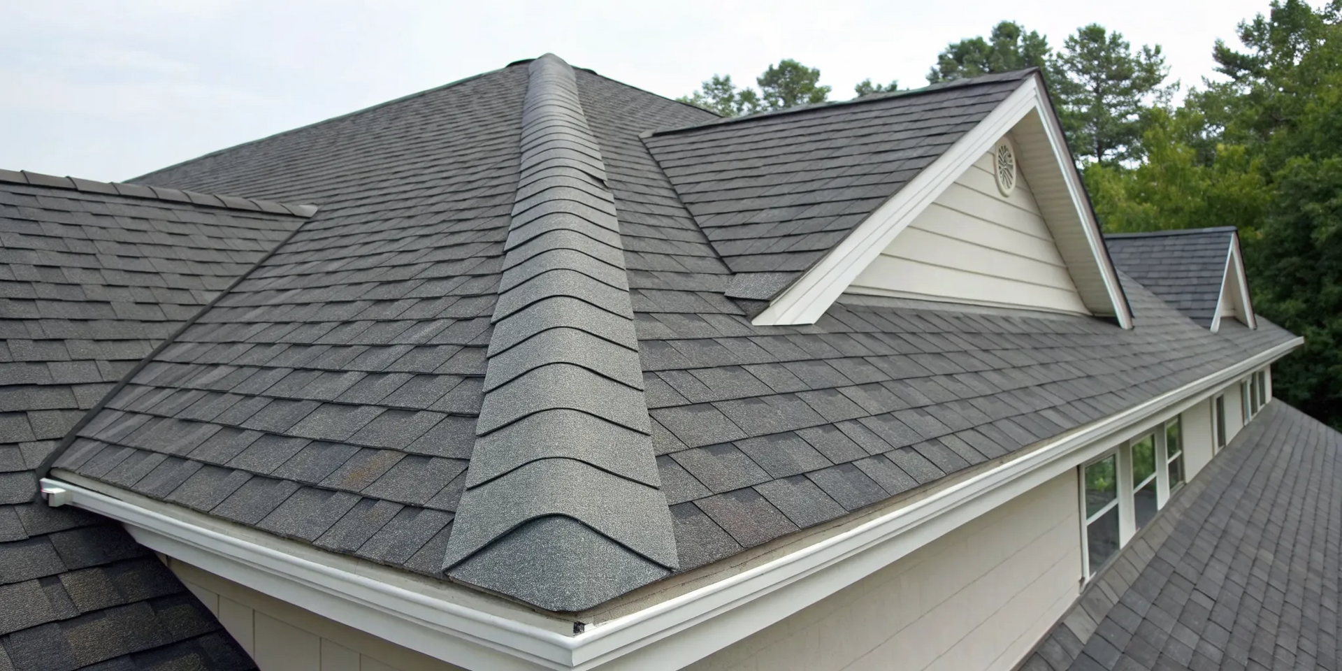 A durable roof of architectural asphalt shingles, key to a long lifespan.
