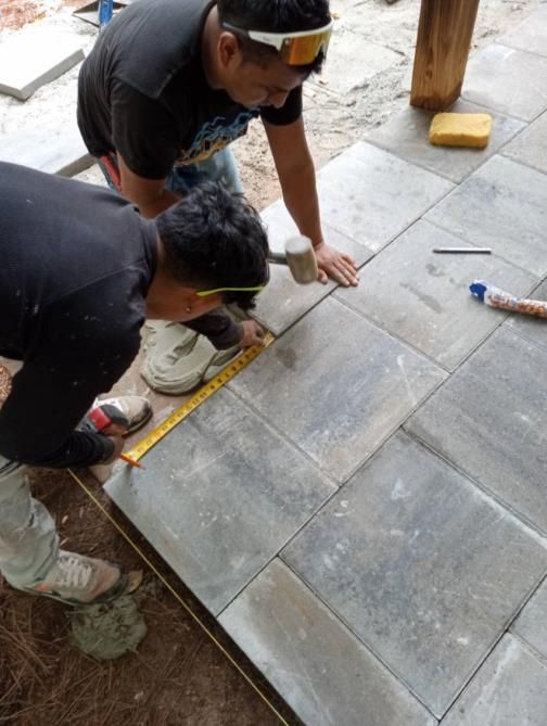 a bathroom under construction with tiles on the floor