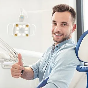 Dental Patient Doing Thumbs Up — Westlake, OH — Aico’s Dental Group