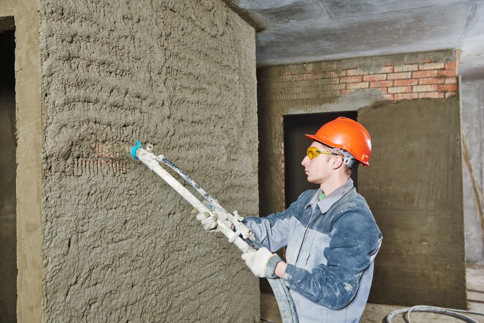 a contractor checking the concrete walls