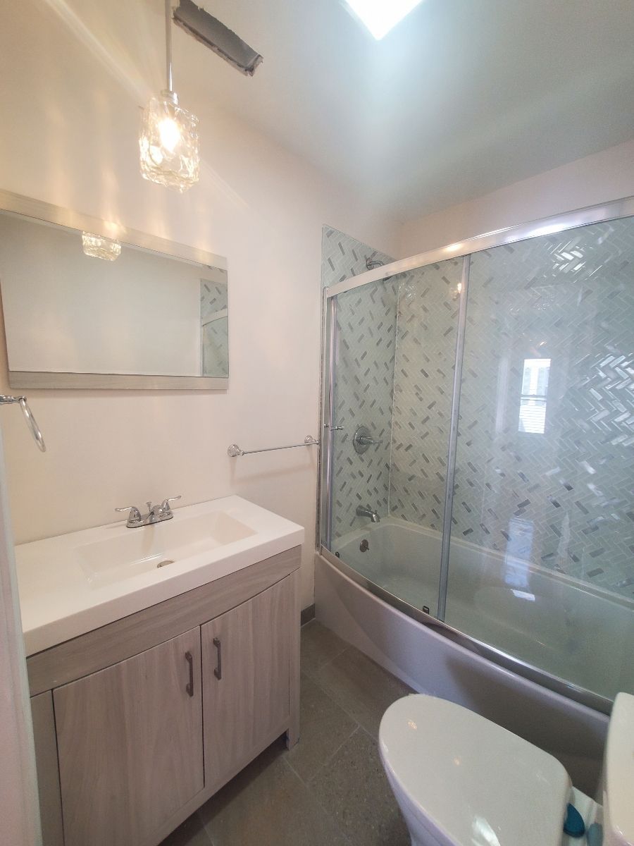 A Bathroom with a sink a toilet and a bathtub – Malden, MA – EG Remodeling LLC