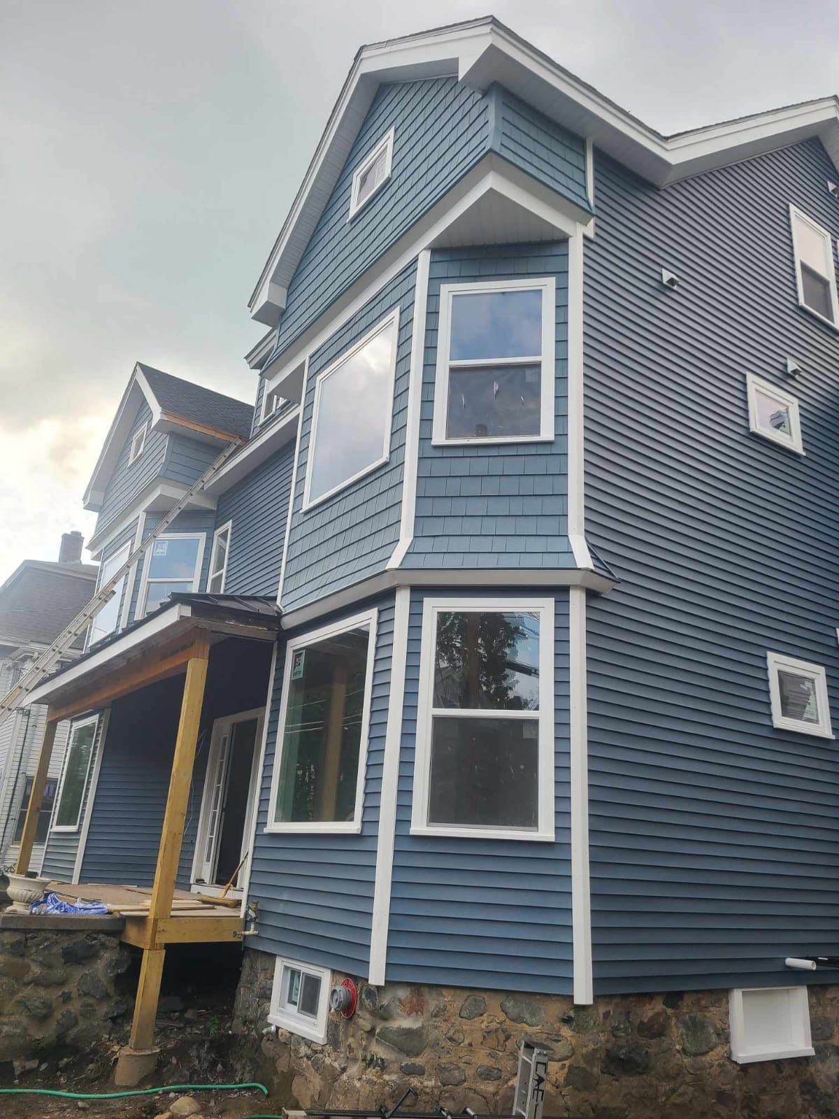 a close up of a black roof with a white sky in the background