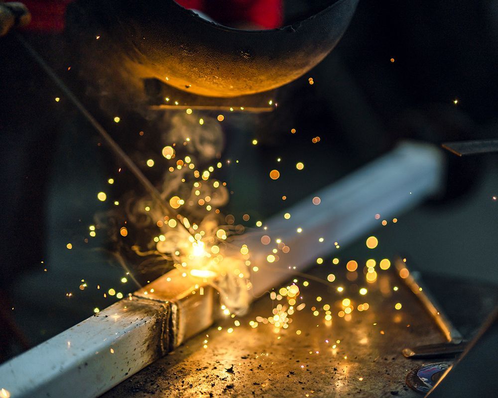 Structural steel welding sparks at Ozark Mountain Steel in Springfield, MO, highlighting steel produ