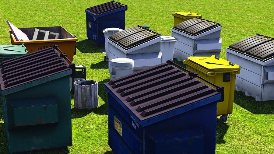 dumpsters in the grass