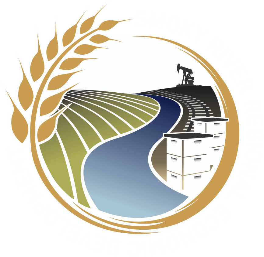 A circular logo showing a golden wheat stalk over a field, a blue river, industrial oil equipment, and storage tanks.