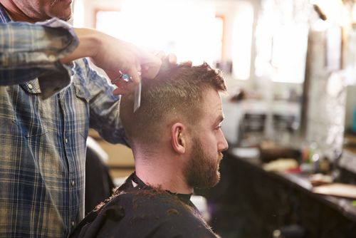 Getting a modern hairstyle at our barber shop