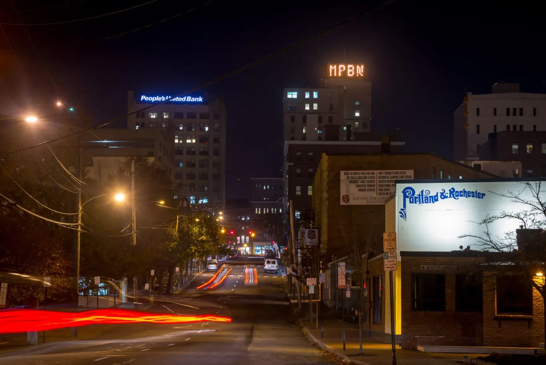 united bank and portland & rochester are lit up at night