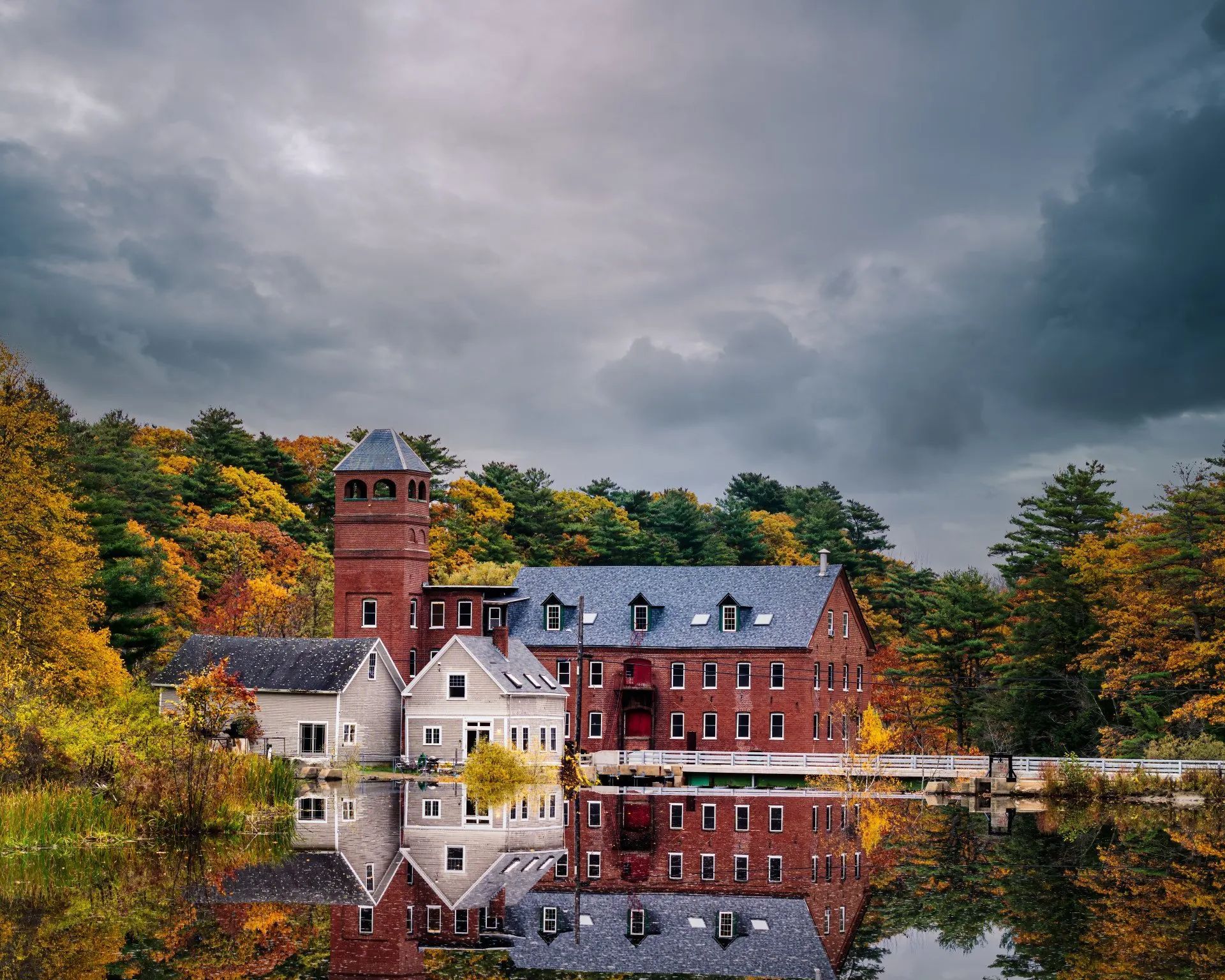 a large building is reflected in a body of water