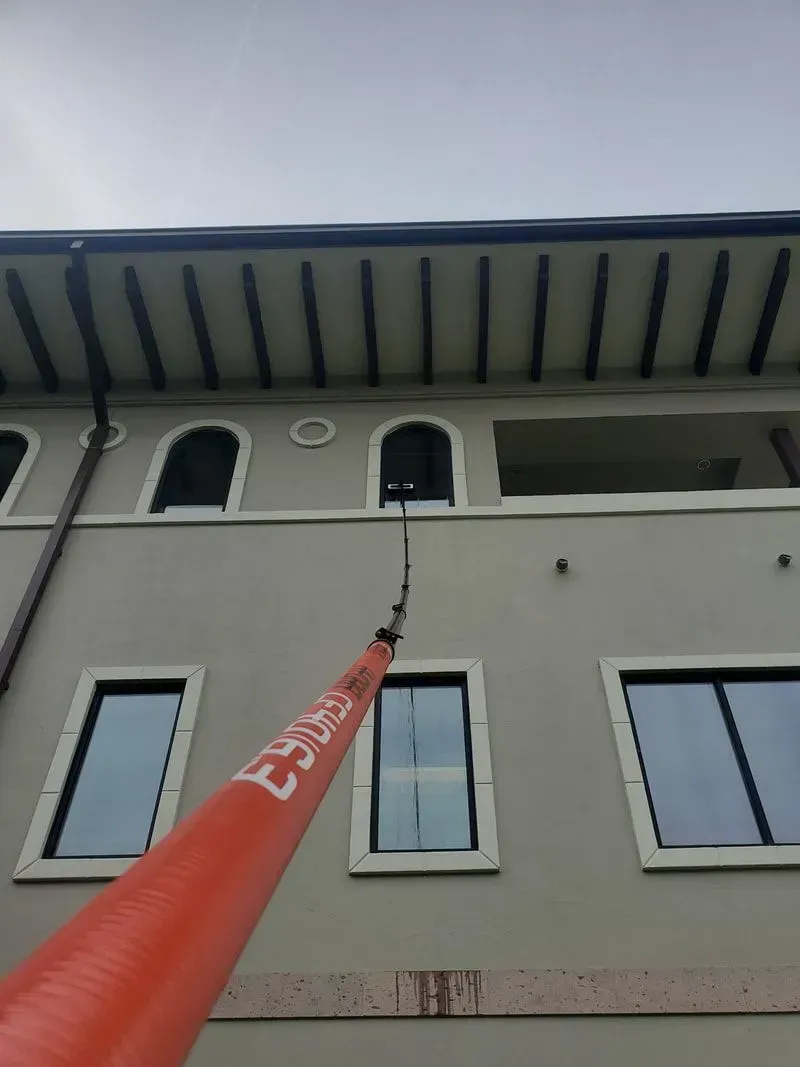 A large building with a red pole on the side that says ' elise ' on it