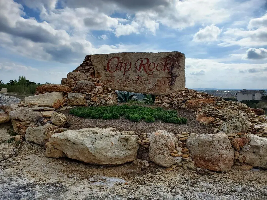 A large rock sitting on top of a pile of rocks.