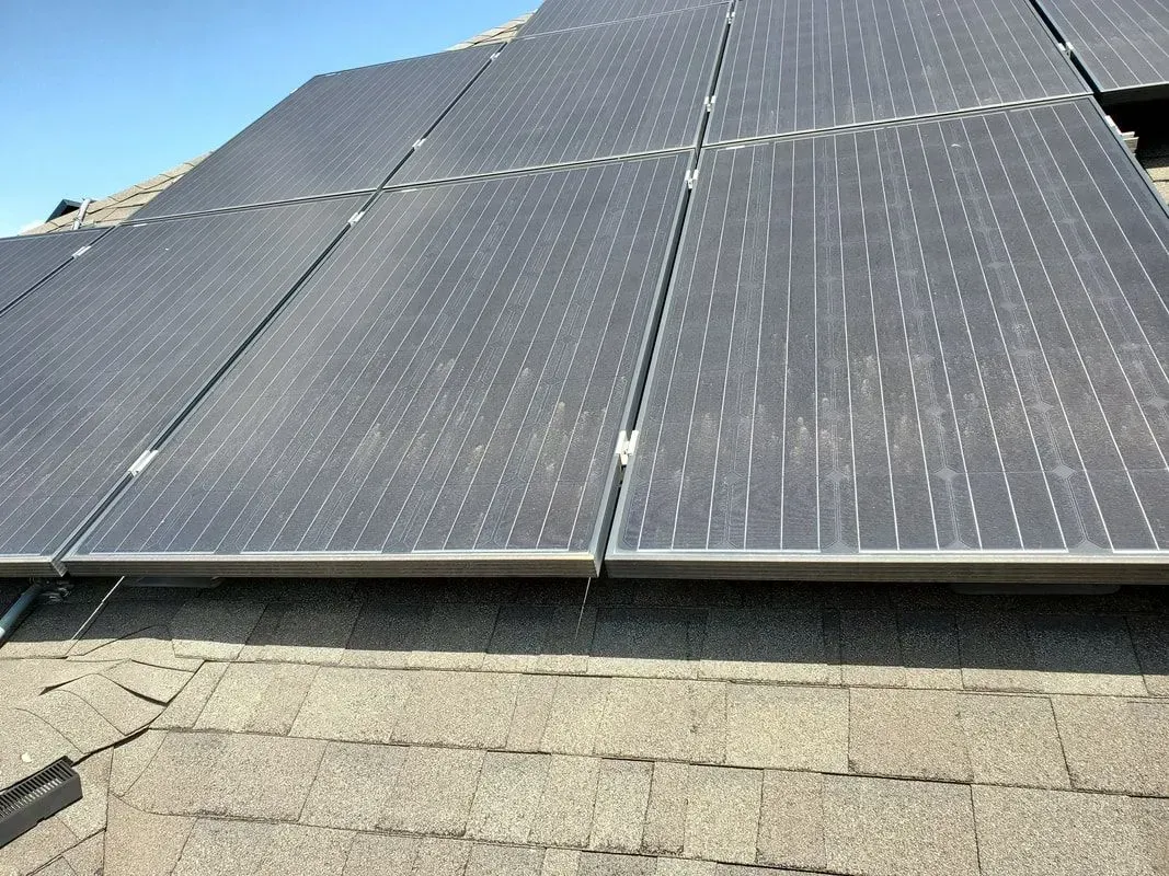 A roof with a lot of solar panels on it