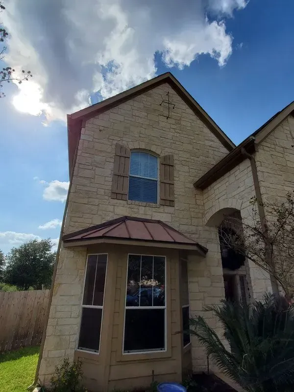 A house with a cross on the top of it