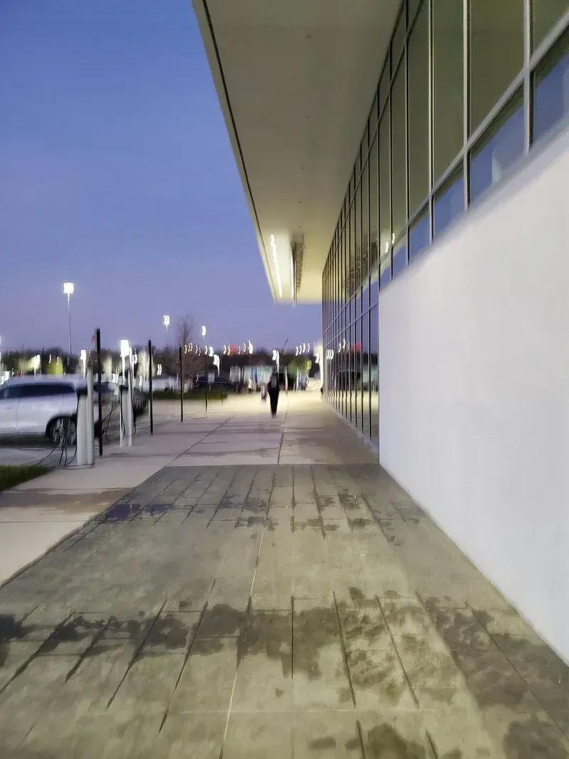 A building with a lot of windows and a walkway