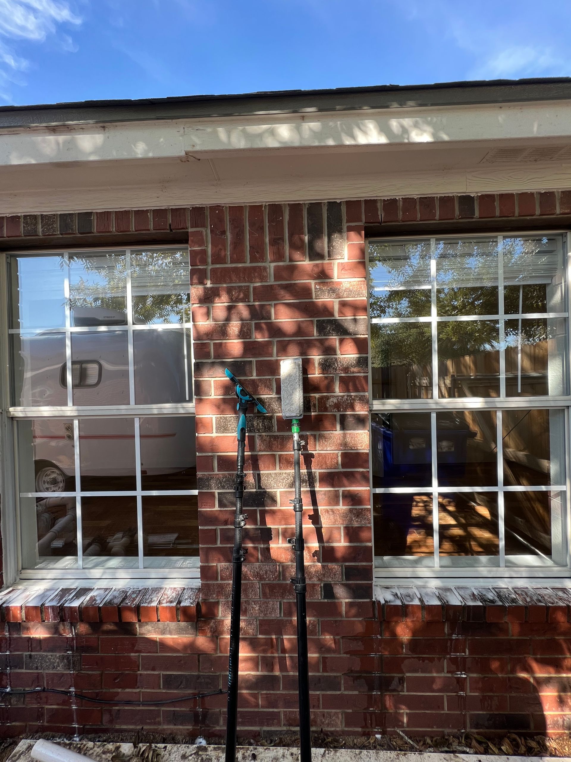 Two residential Round Rock Windows after being cleaned