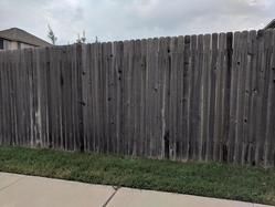 Dirty residential wood fence 