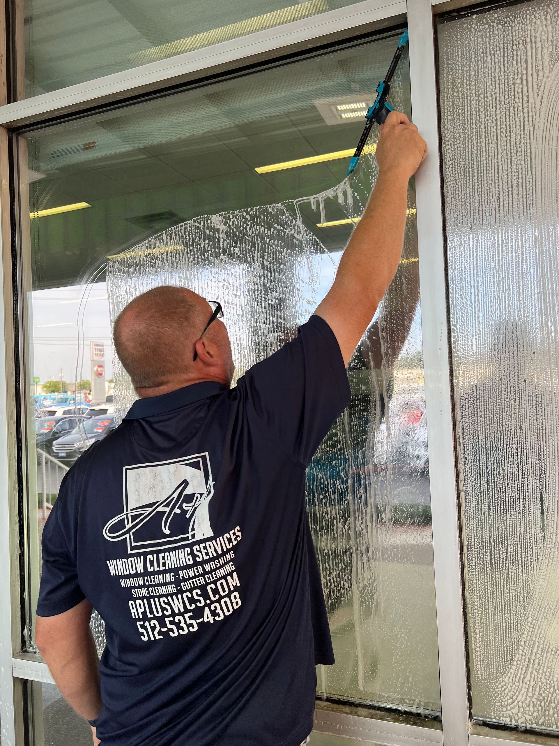 Commercial window cleaning with a squeegee