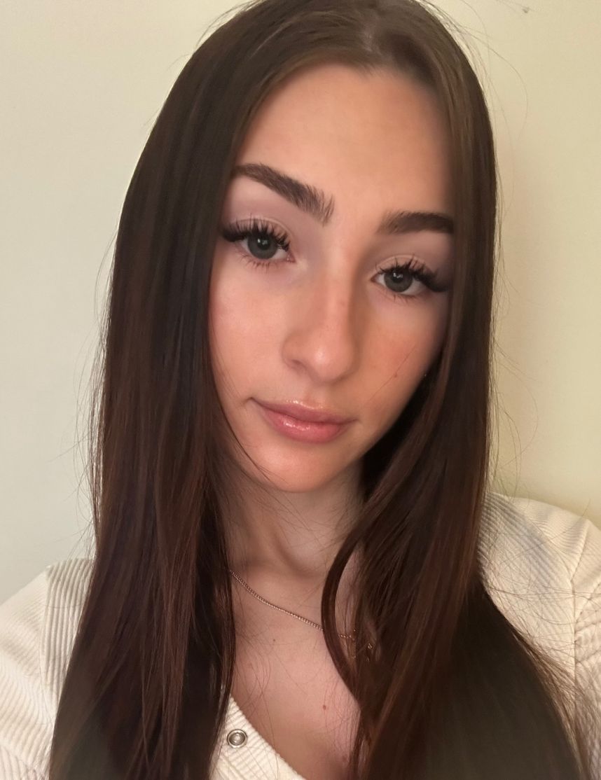 Young girl with dark hair and beautiful lashes.