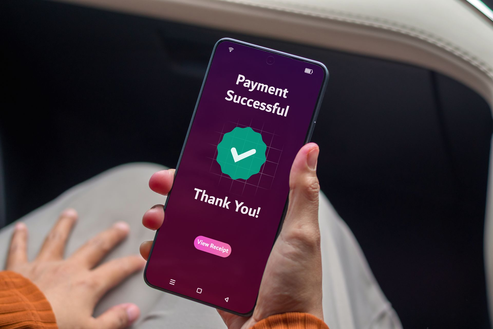 Person holding a phone displaying a 