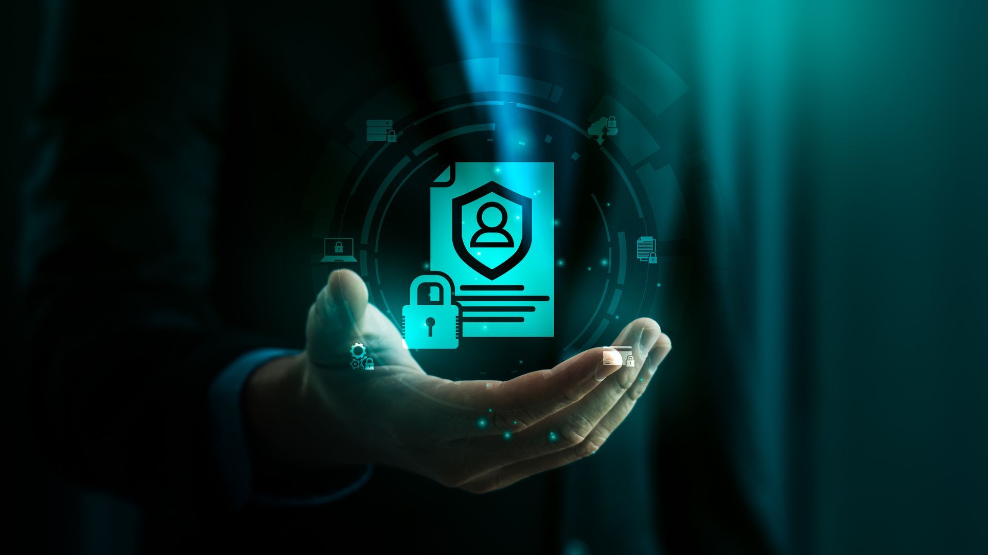 Hand holding a glowing digital document icon with a shield, lock, and person symbol.