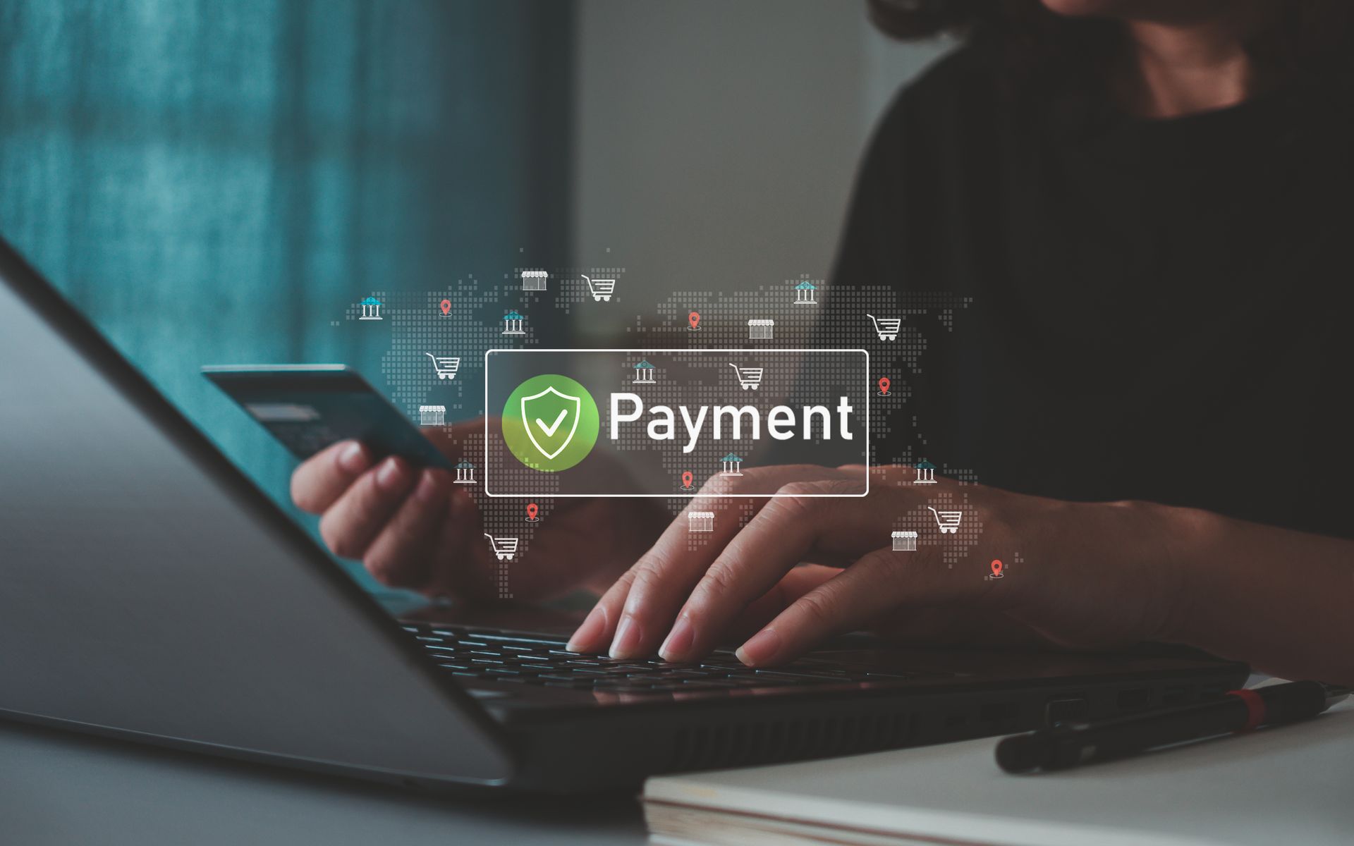 Person making an online payment on a laptop using a credit card.