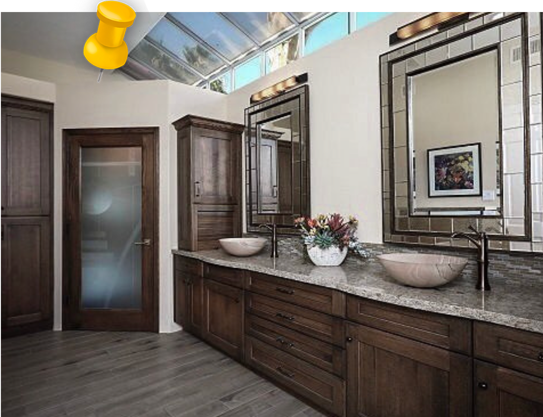 a bathroom with two sinks and two mirrors
