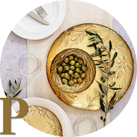 gold-rimmed plate with olives