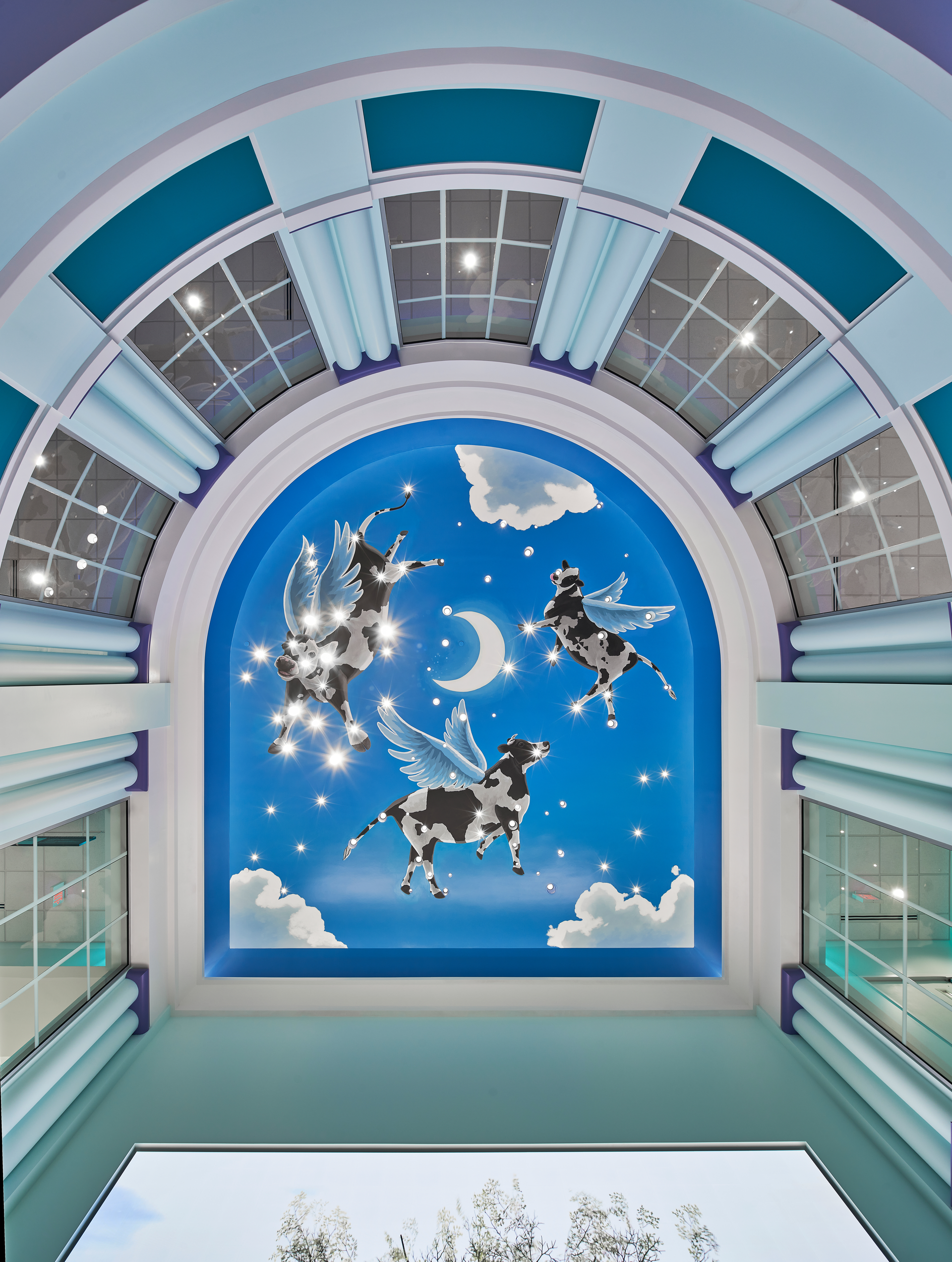 Image of painted cows on a ceiling with stars moon and clouds