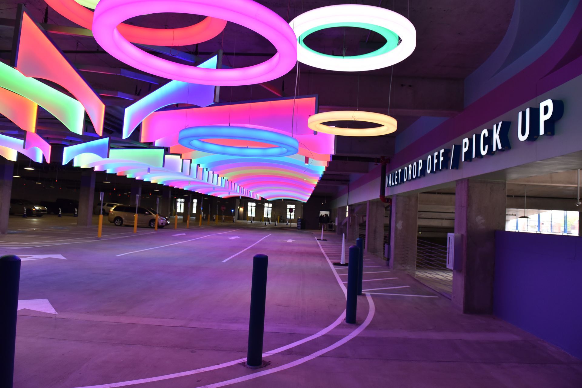 Colorful, illuminated pick-up area with circular and rectangular lights. 