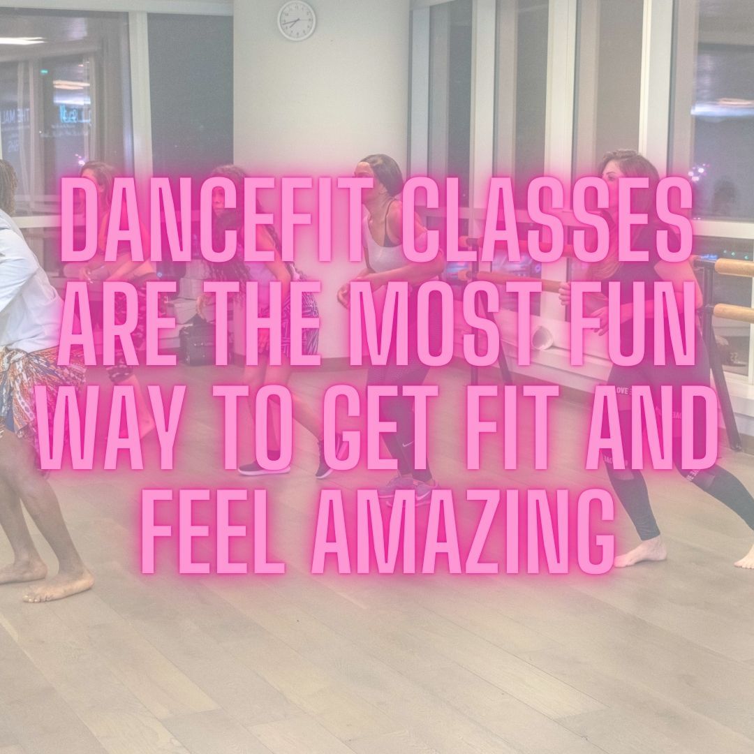 Group of people smiling and dancing together in a DanceFIT fitness class