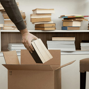 books being put into carton boxes
