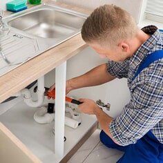Plumber Fixing Sink Pipe — Emergency Repair Service in Tallahassee, FL