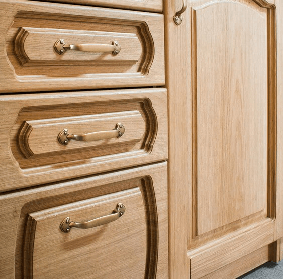 wooden cupboard and drawers with brass handles