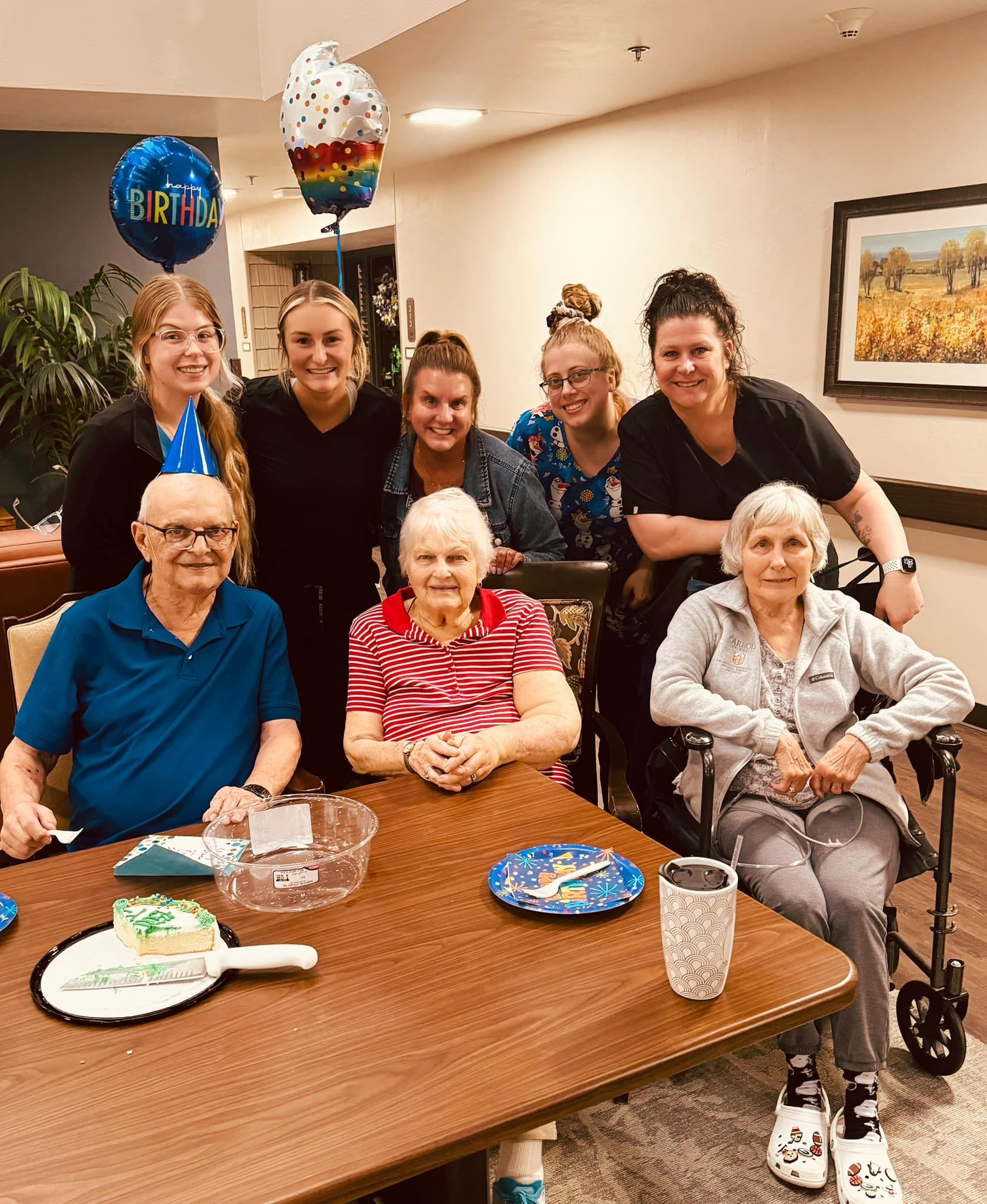 The Tender Hearts team is posing for a picture at a birthday party.
