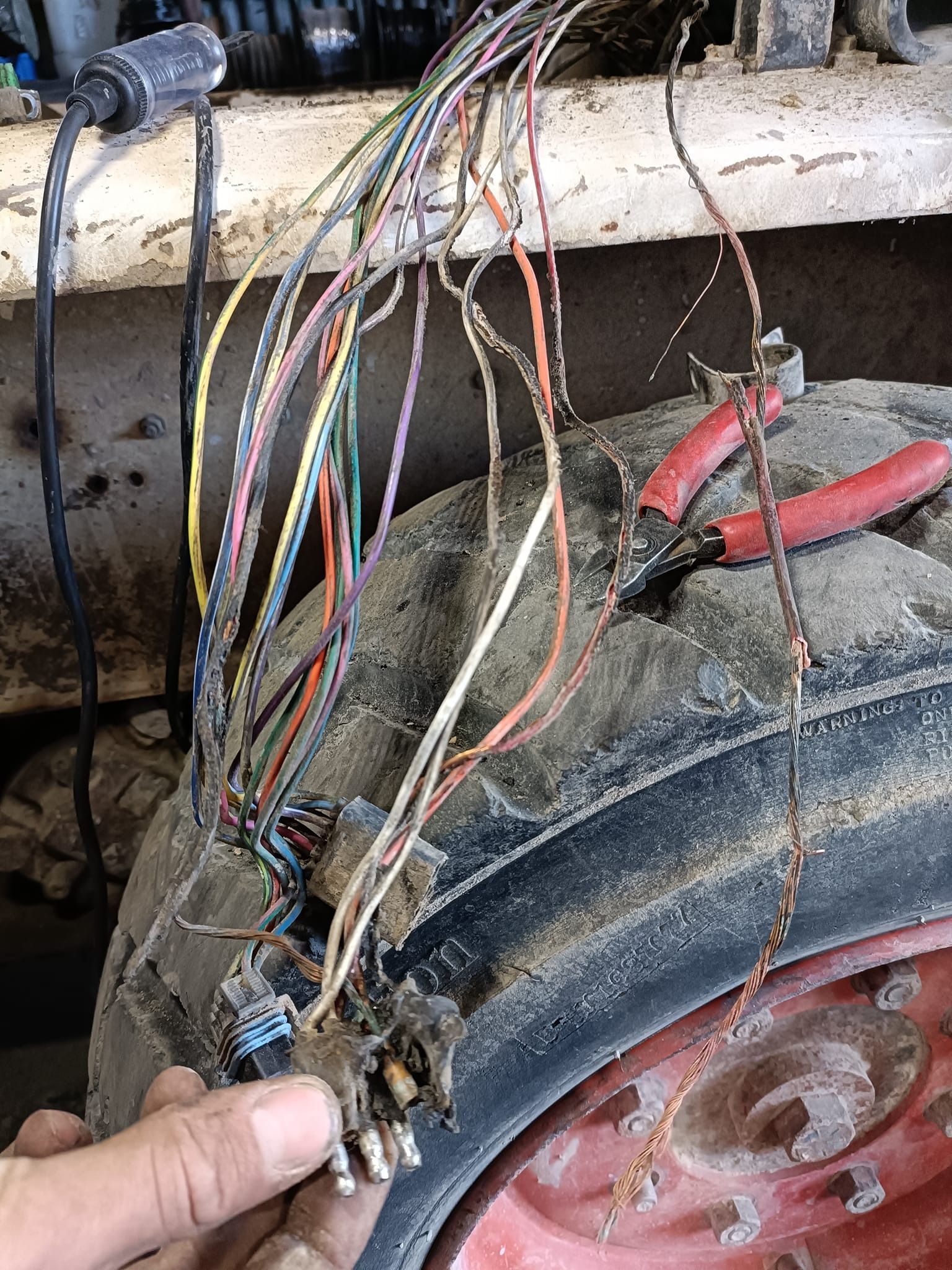 Auto Electrician Fixing Faulty Wires