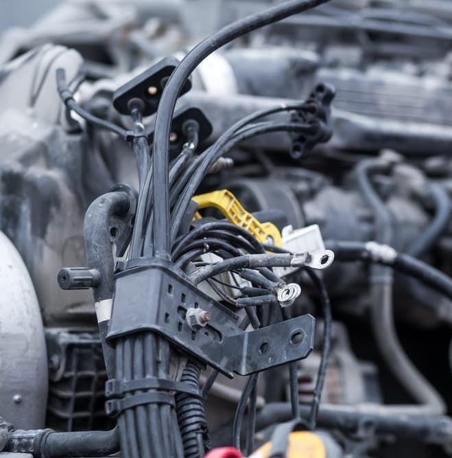 A bundle of electrical wires in a car's engine bay — Auto Electrical & Air Conditioning in Tamworth, NSW