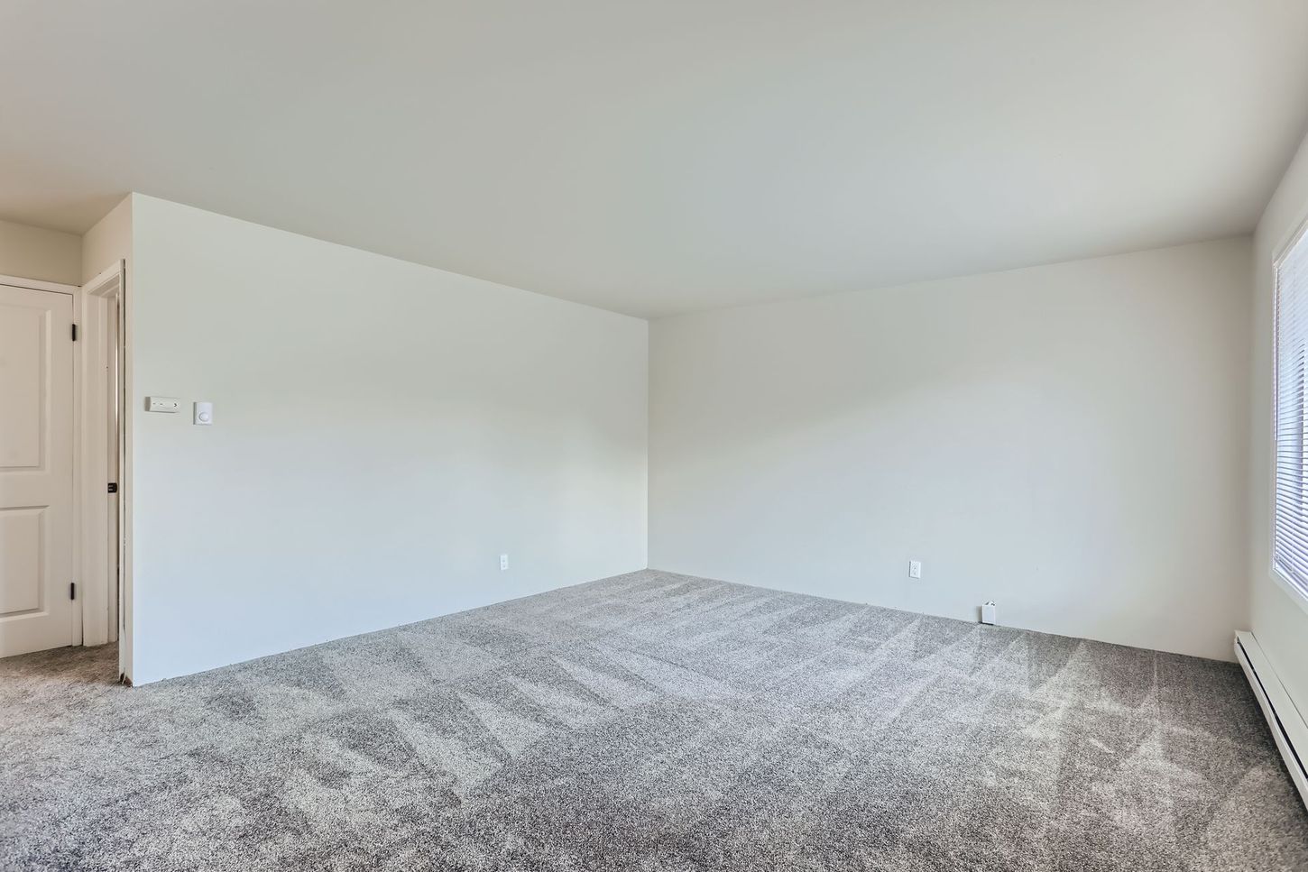 Photo showing the living room with plenty of natural light coming in