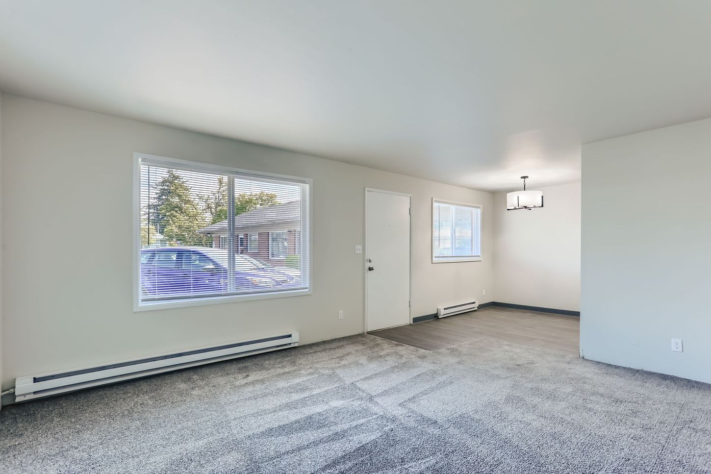 Living room with dining area and plenty of natural lighting