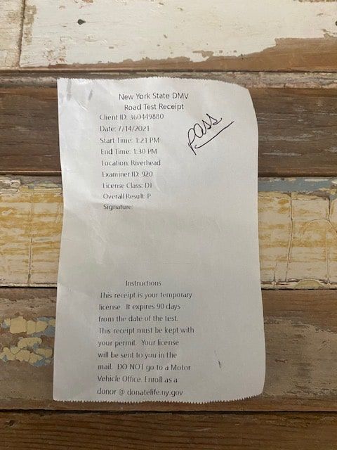 White paper with handwritten text, labeled 