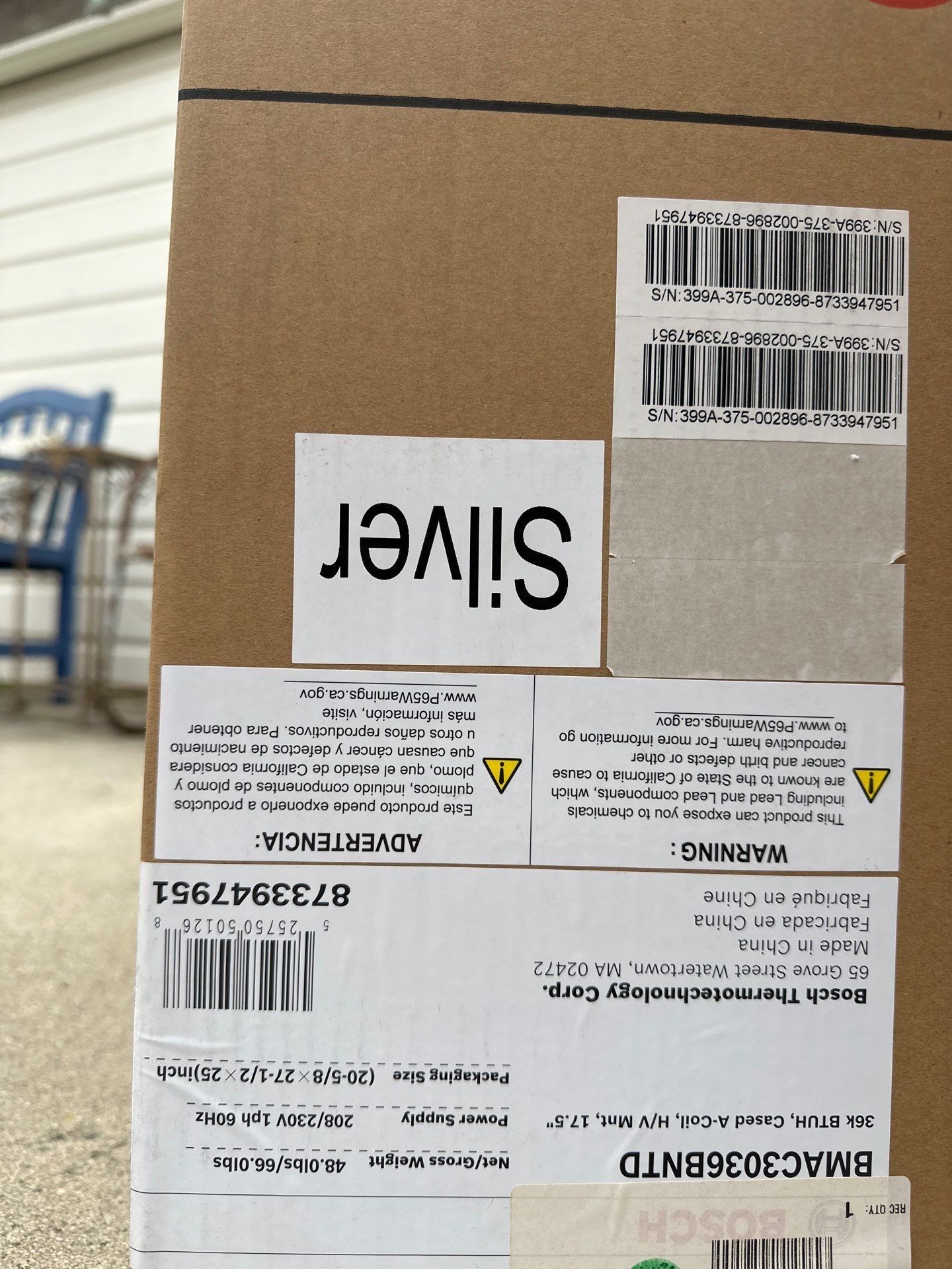 Cardboard box with shipping labels and 