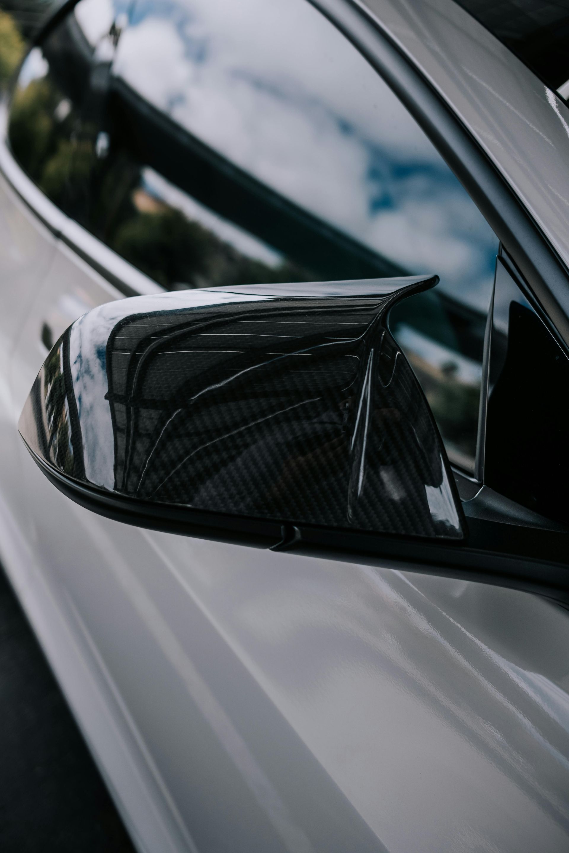 A close up of a car 's side view mirror.