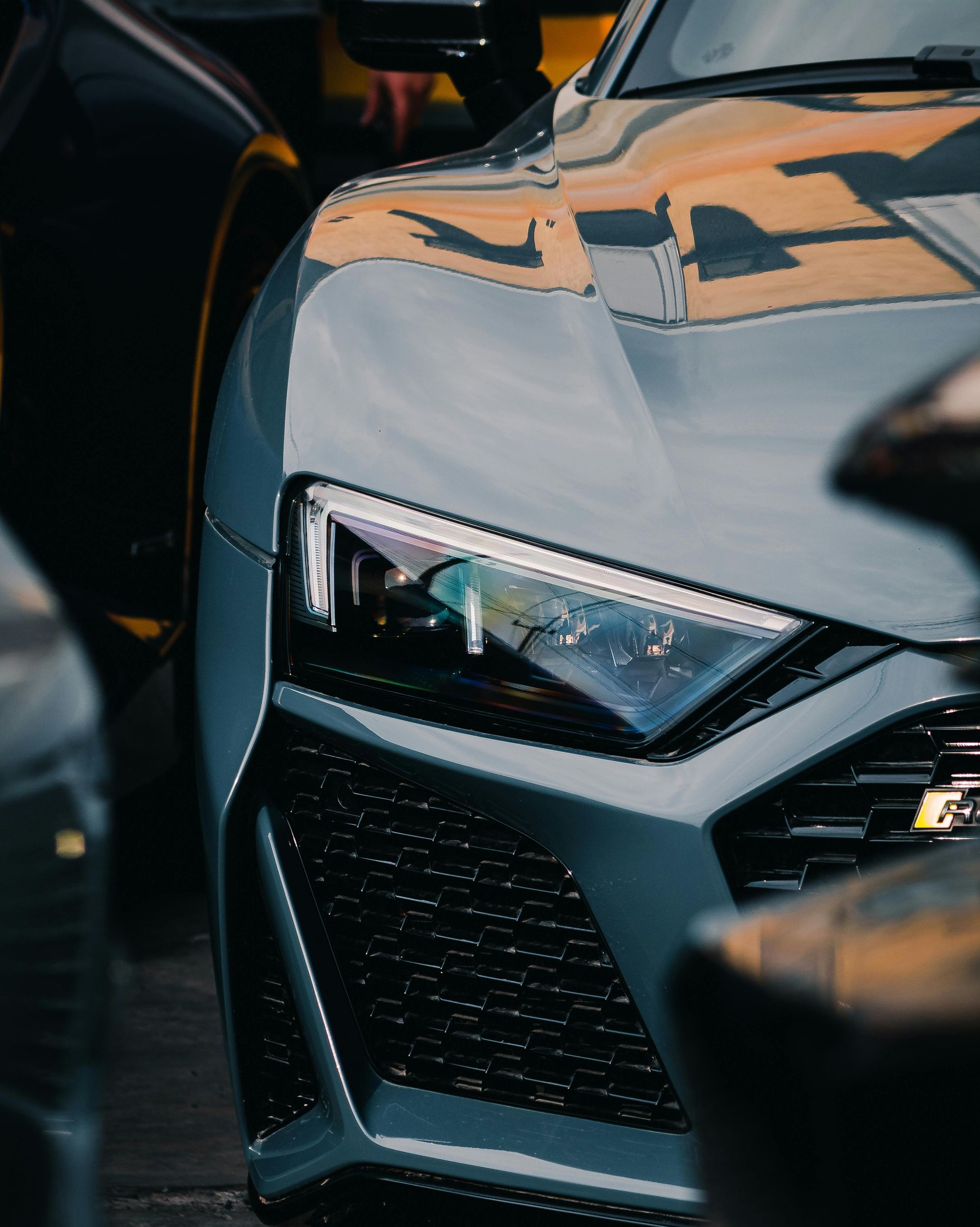 A close up of a car parked next to another car.
