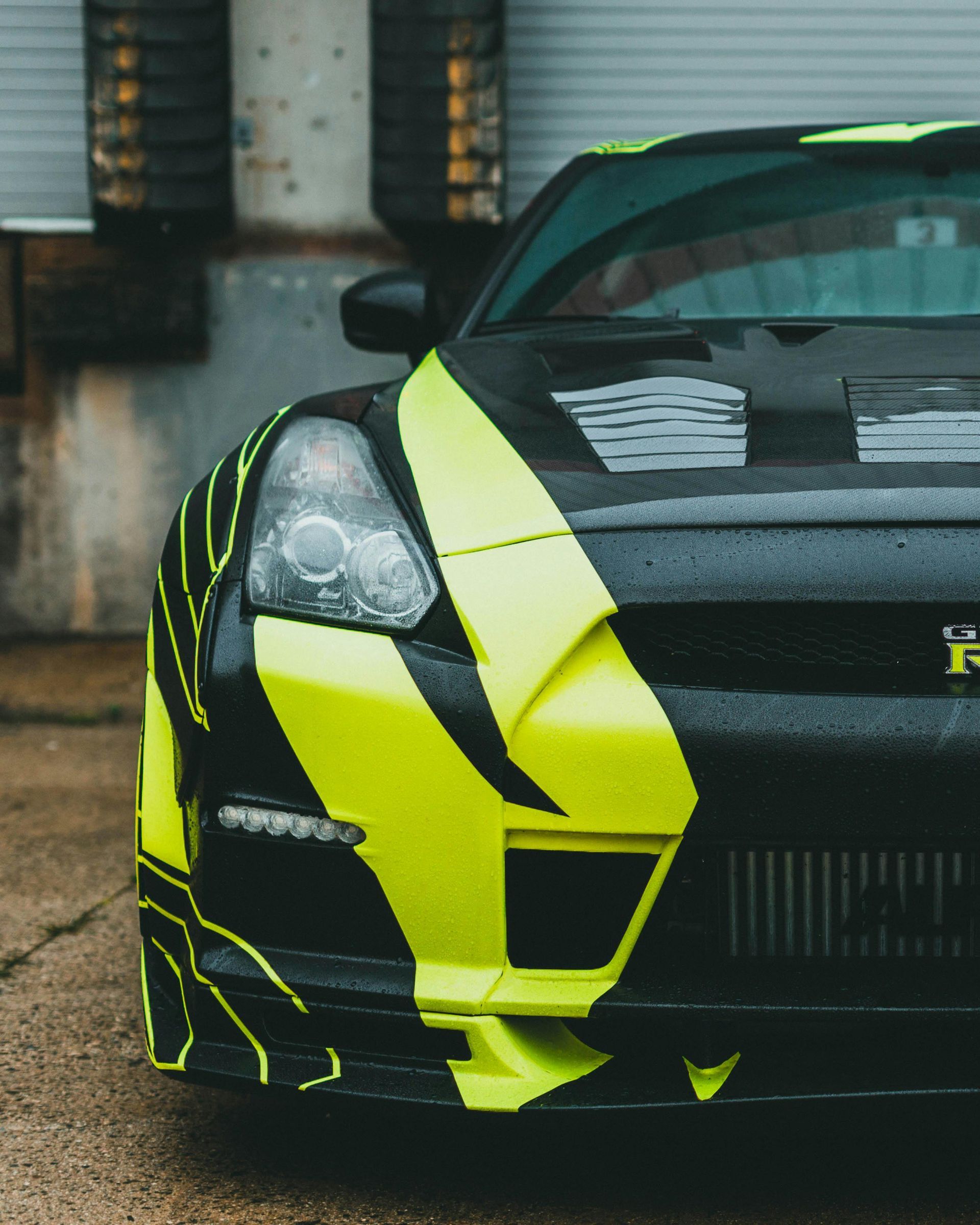 A black and yellow car with the letter r on the front