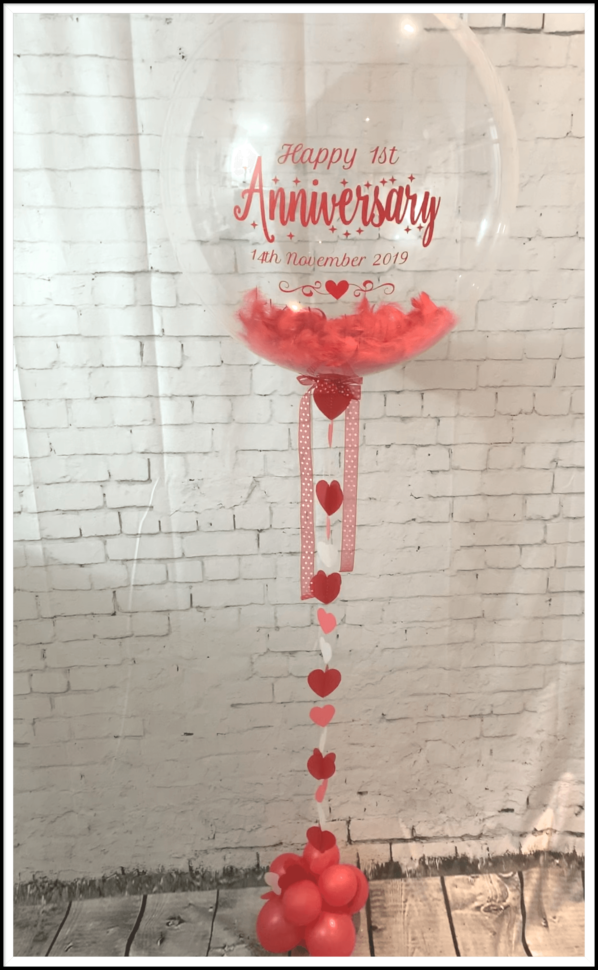 personalised anniversary balloon with feathers