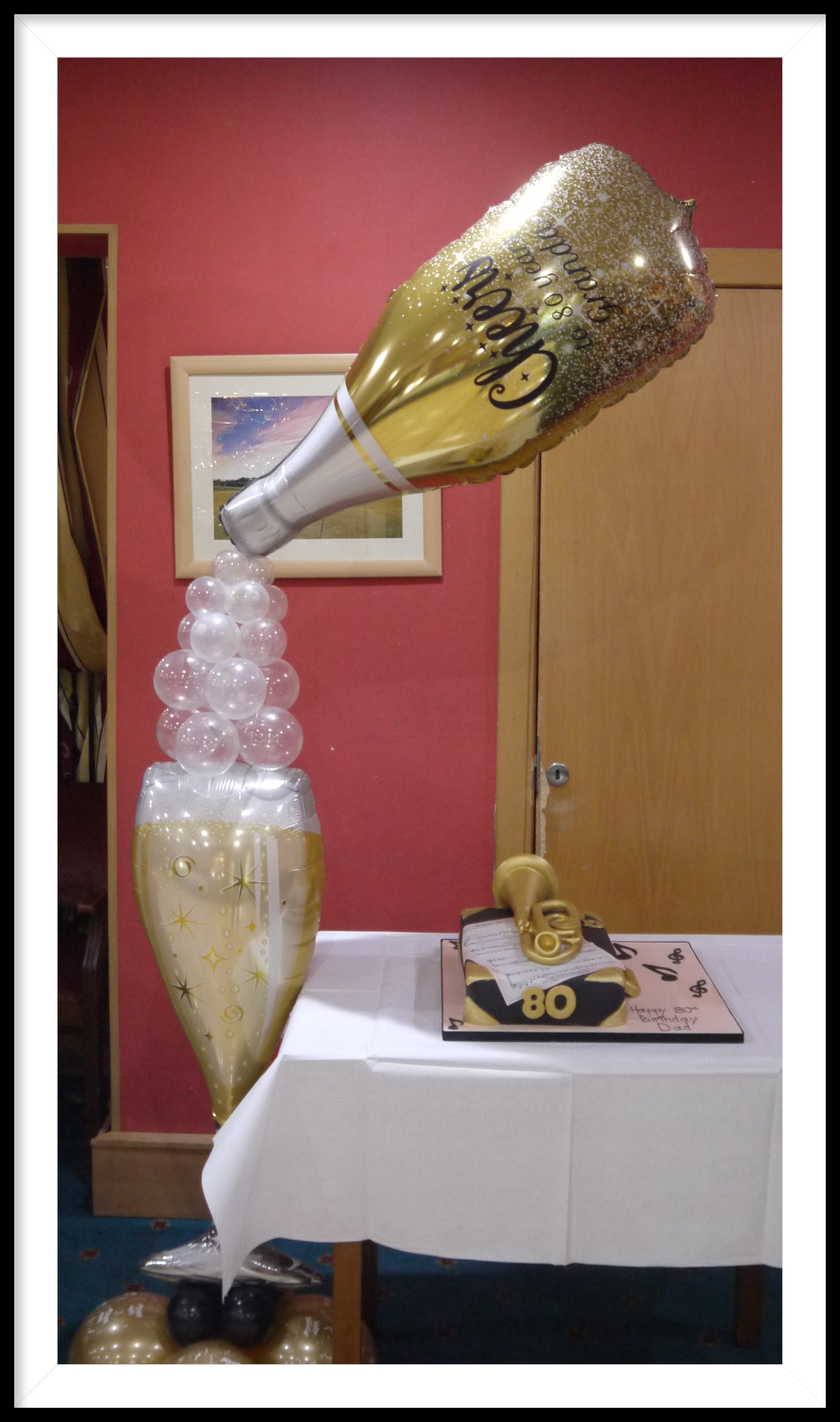 pouring champagne bottle and glass balloon