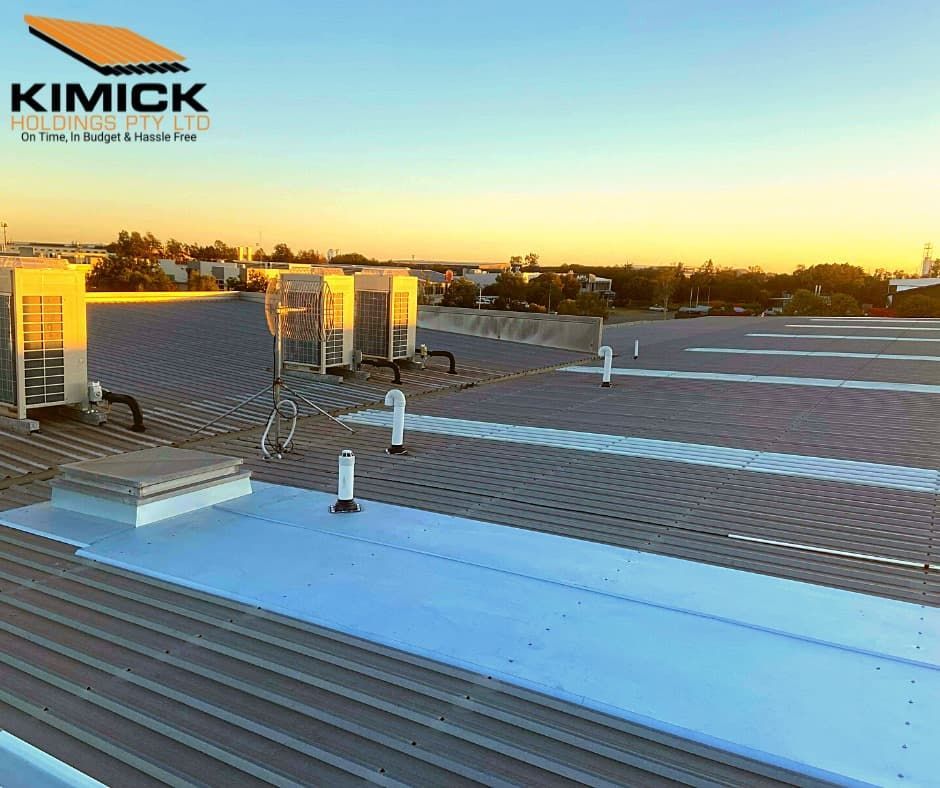 A Large Roof With A Lot Of Air Conditioners On It — Kimick Roofing Solutions In Fortitude Valley, QLD