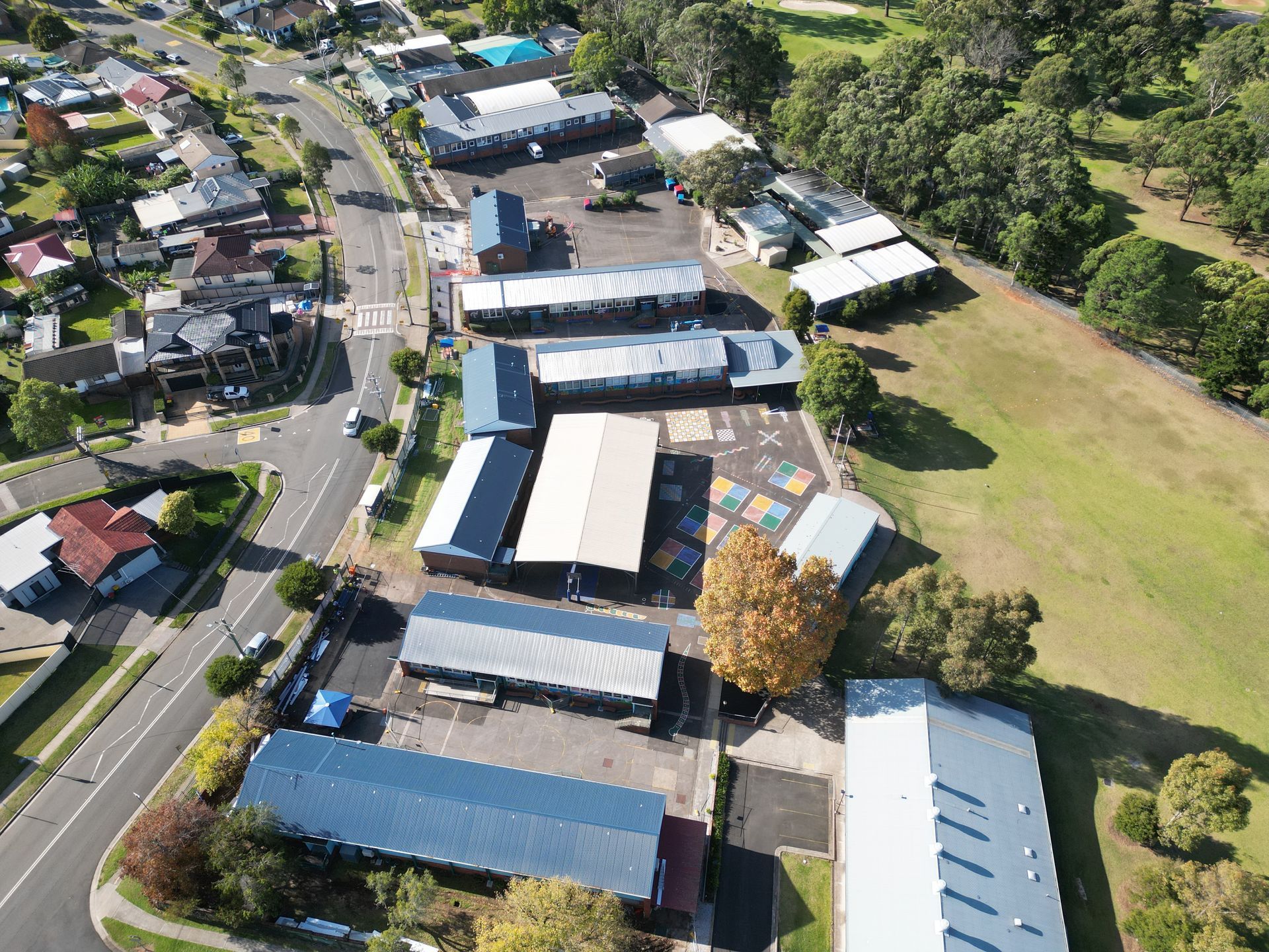 An aerial view of a residential area with lots of buildings and trees