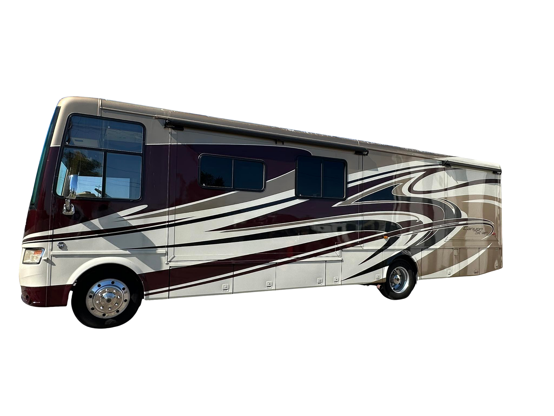 Tan and maroon RV with decorative side accents.